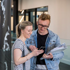 Students looking at a phone