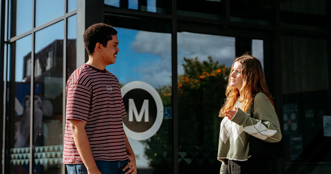 Toi Ohomai students talking to each other on campus