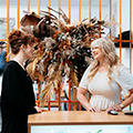 Hair and Beauty tutor talking with client