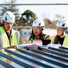 Health and Safety students with their tutor looking over plans Health and Safety students with their tutor looking over plans