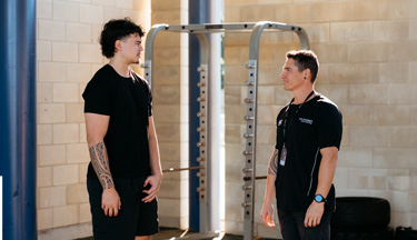 Student with tutor talking to each other about an exercise
