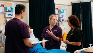Nursing students with their tutor