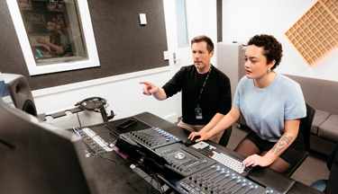 Music students in studio with their tutor