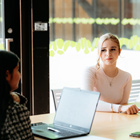 Postgraduate students sitting around a table