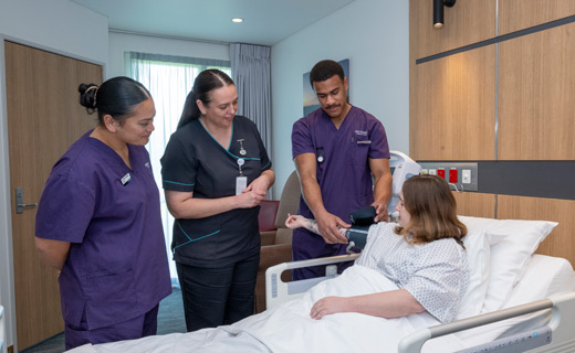 Nursing students with a patient