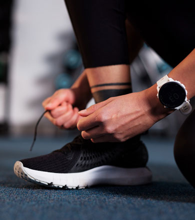 Sport student tying up their shoes