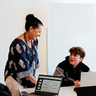 Tutor talking to their student