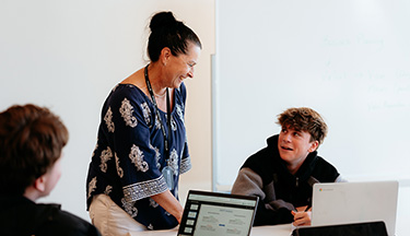 Tutor talking to their student