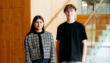 International student standing with a domestic student