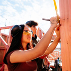 Māori and Pasifika Trade Training student measuring on site