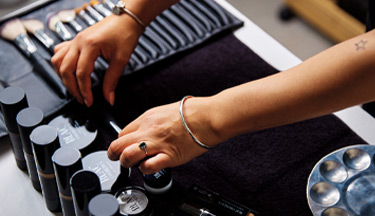 Beauty student choosing makeup 