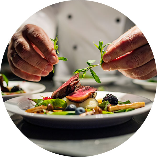 Culinary Arts student garnishing food