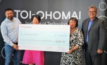 Toi Ohomai Chief Executive Leon Fourie hands over cheque to Ōpōtiki’s KŌ Kollective Trust.