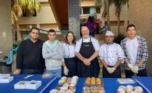 Noel Remacle with bakery students at Pharos University
